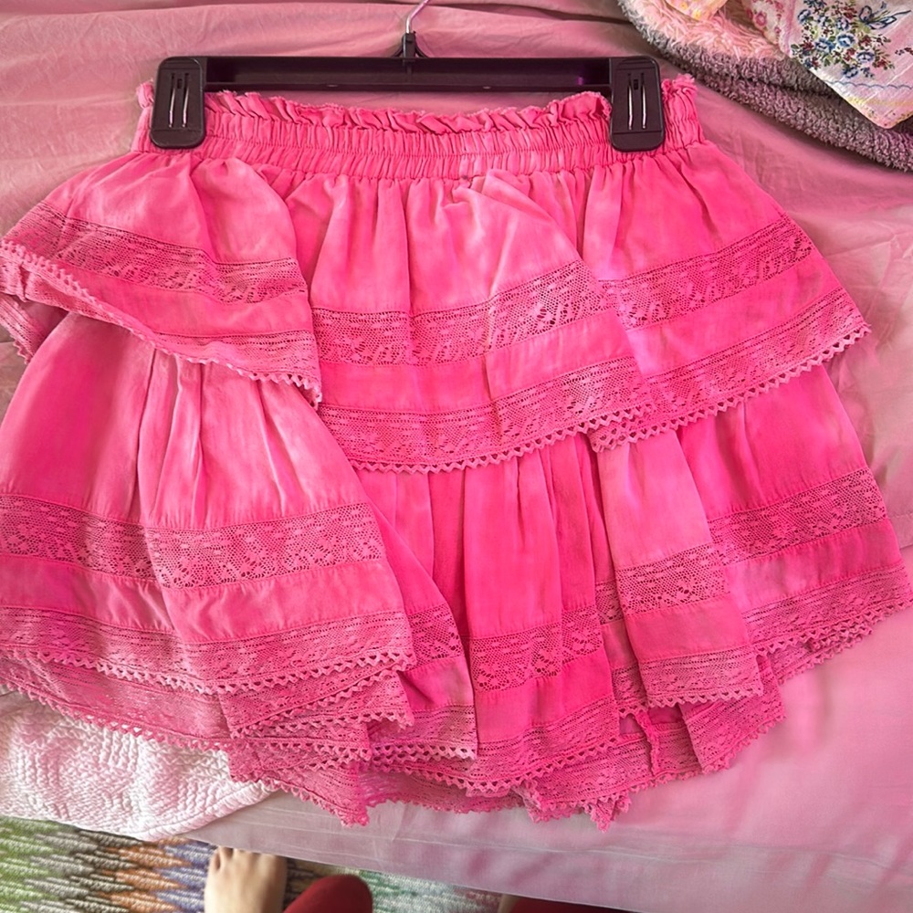Pink kind of tie dye mini skirt from loveshack fancy.